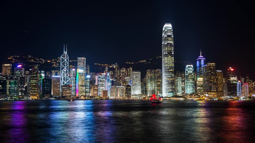 Time lapse of the city lights at river traffic at night