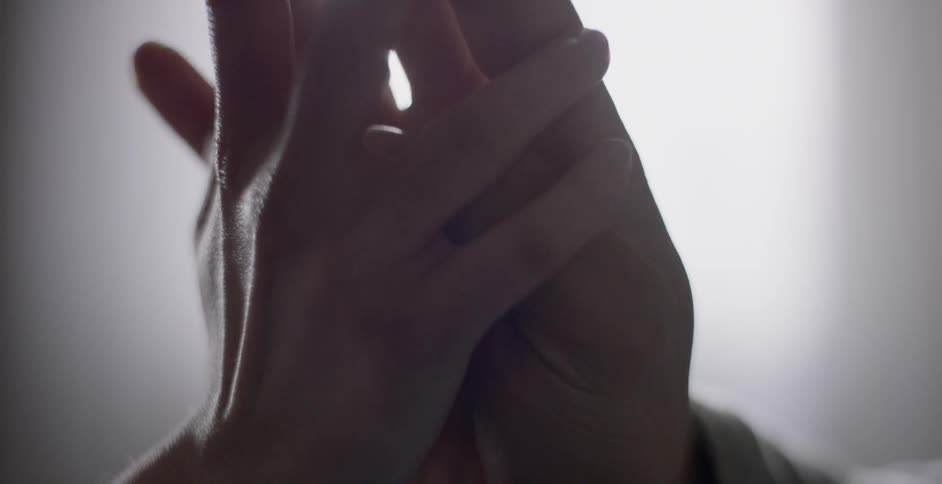 Two people are touching each others hands