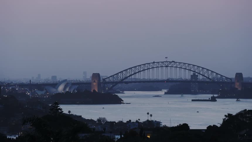 A bridge stretches across a city canal