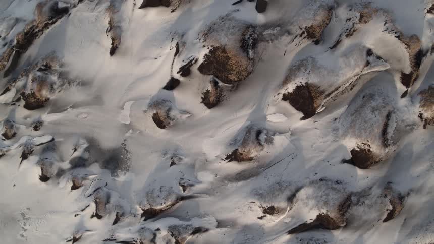 Snow covers a rocky landscape