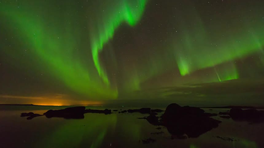 The sky is bright with northern lights