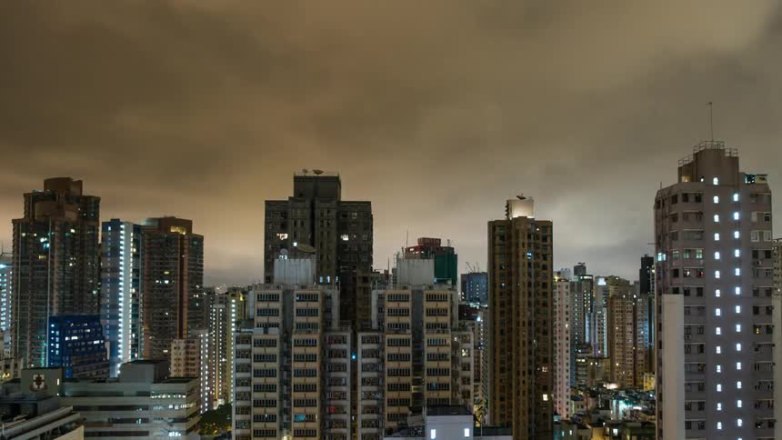 Stormy night sky above Hong Kong skyline