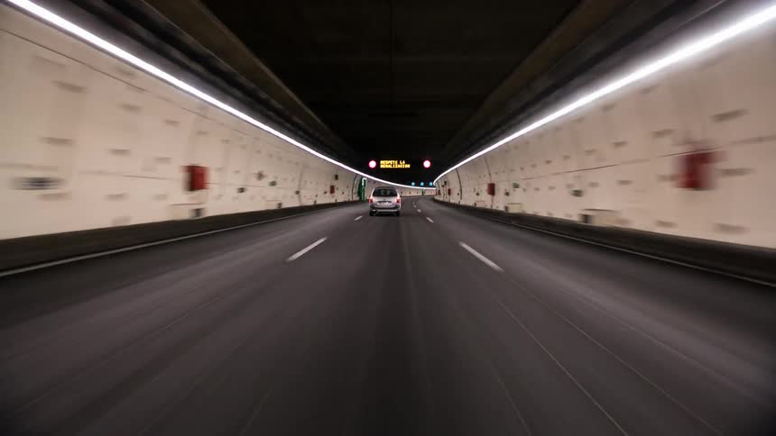 Vehicles travel through an underground tunnel