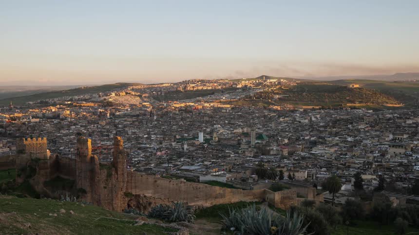 The sun sets slowly darkening the town in Morocco