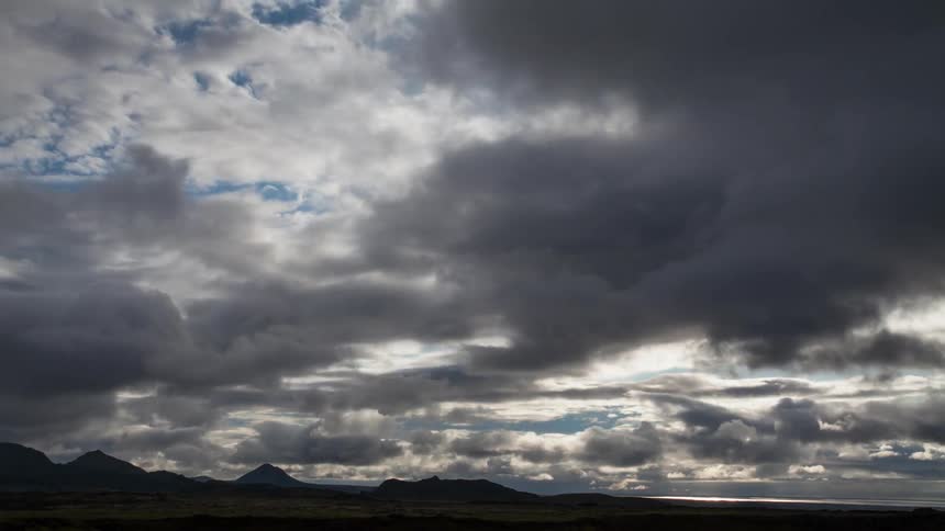 Heavy clouds cover the skyline above