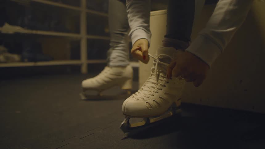 Someone is in the locker room lacing up their ice skates
