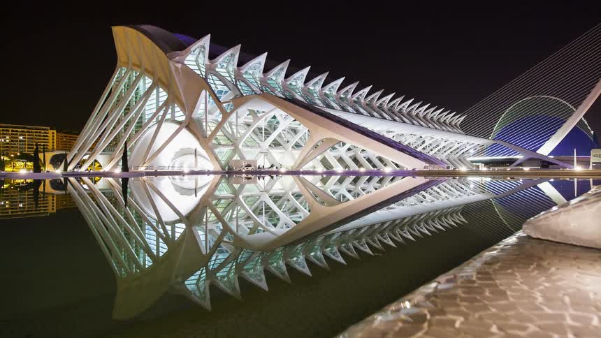 A museum surrounded by water at night