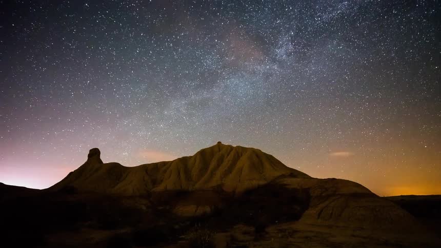 Time lapse of the stars above the desert rocks