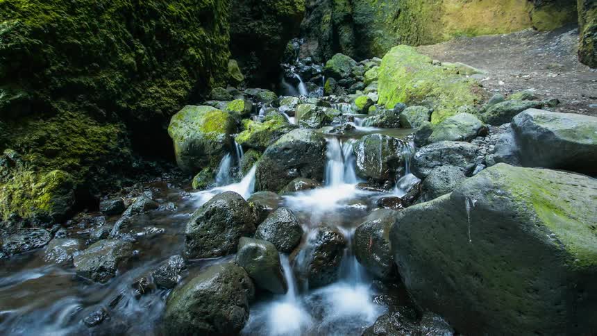 Time lapse of a small waterfall in the woods