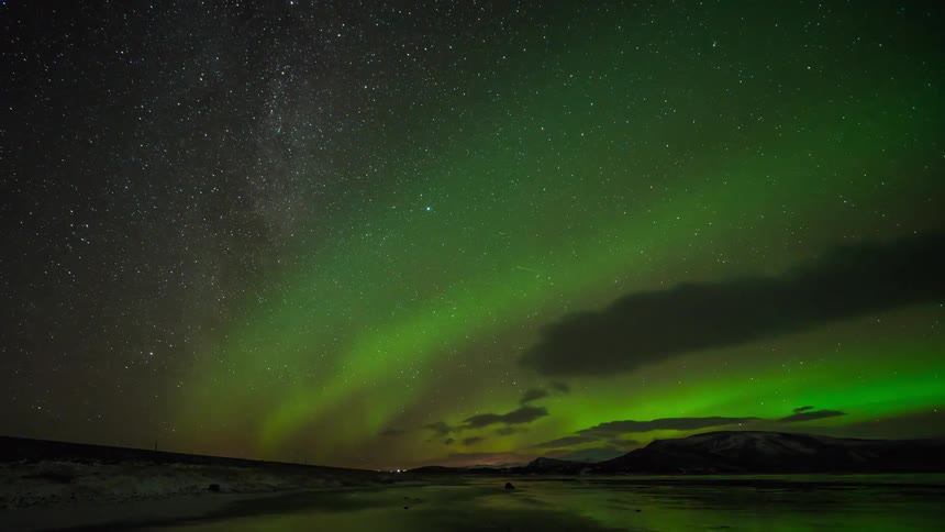Time lapse of the aurora over a body of water