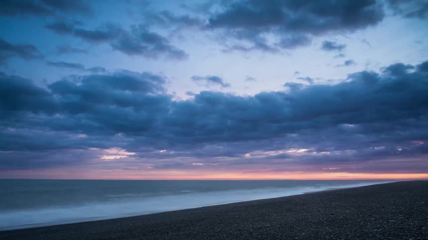 Time lapse of clouds moving across the ocean