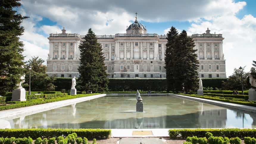 People walk past the long fountain