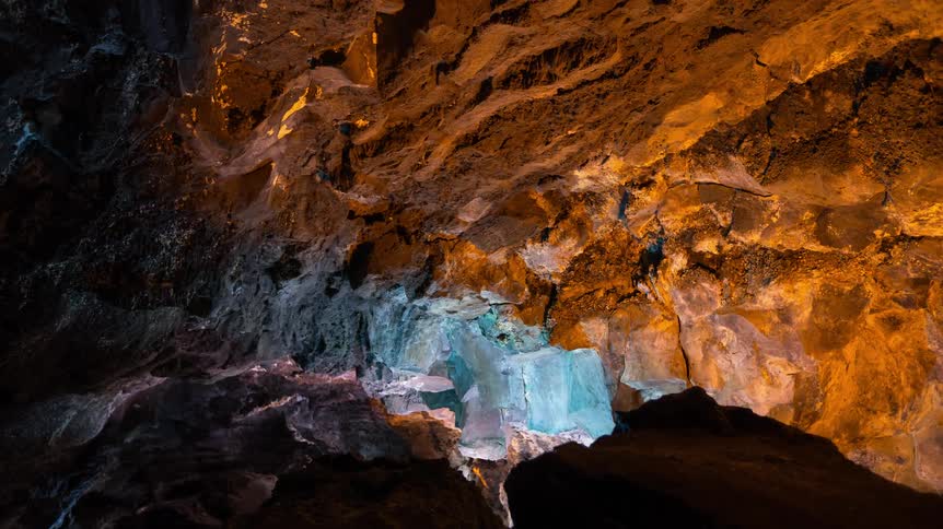 Multi colored lights inside a cave