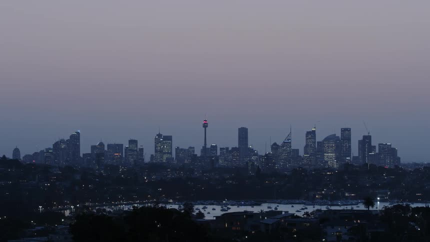 Tall city buildings cover the skyline