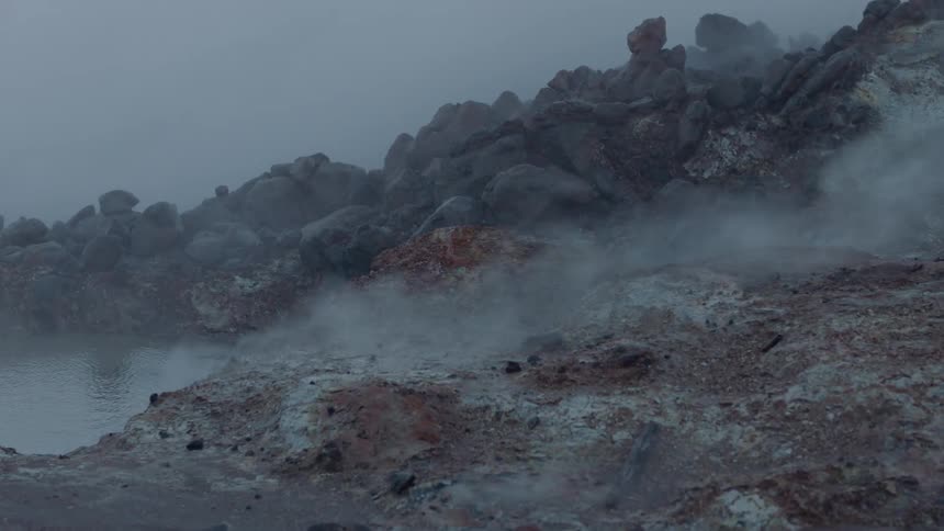 Steam is rising out of a hot spring