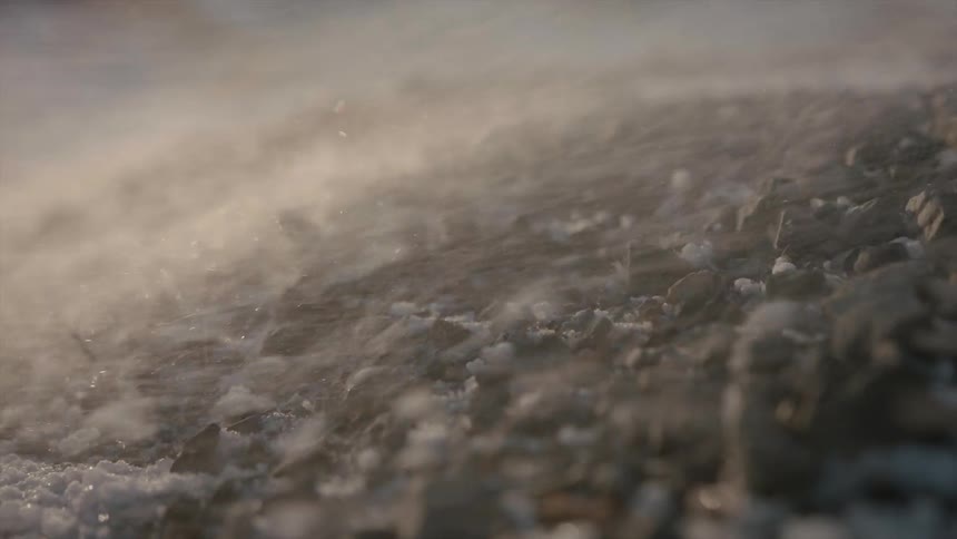 Debris is blown across the ground by high winds