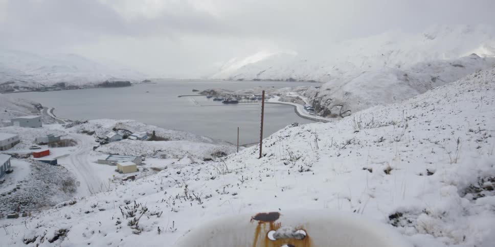 A rusted tub on a snowy hill