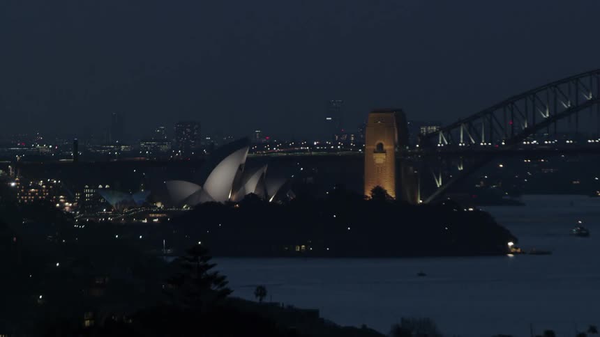 The sydney opera house next to the Sydney harbour in australia
