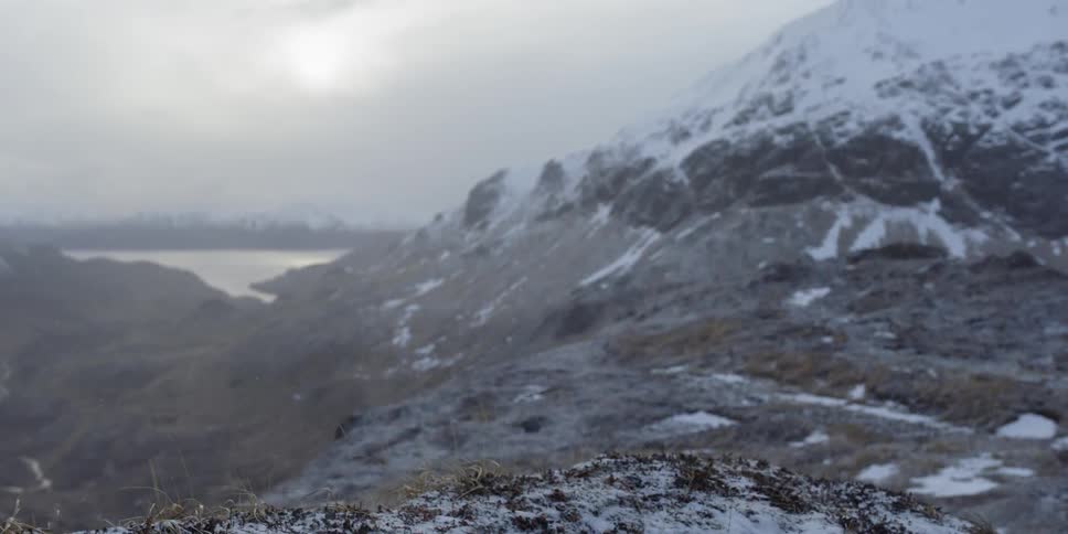 Snow falls in the mountains