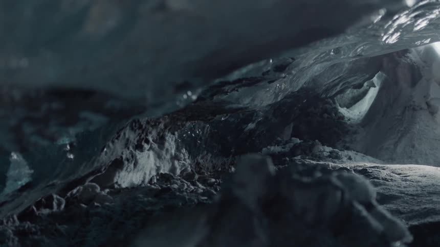 Water drips down onto an ice formation