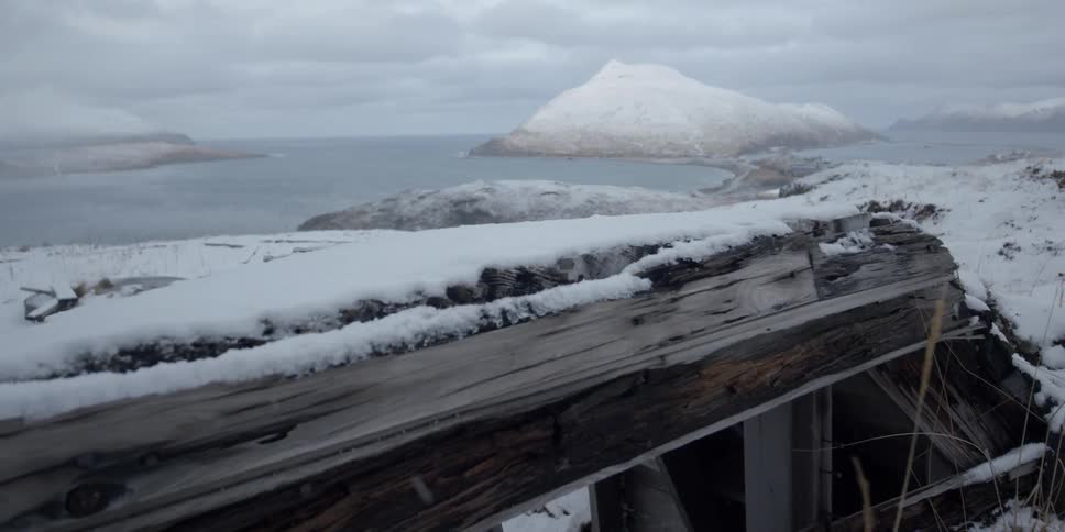 Snow on a wood structure over the sea