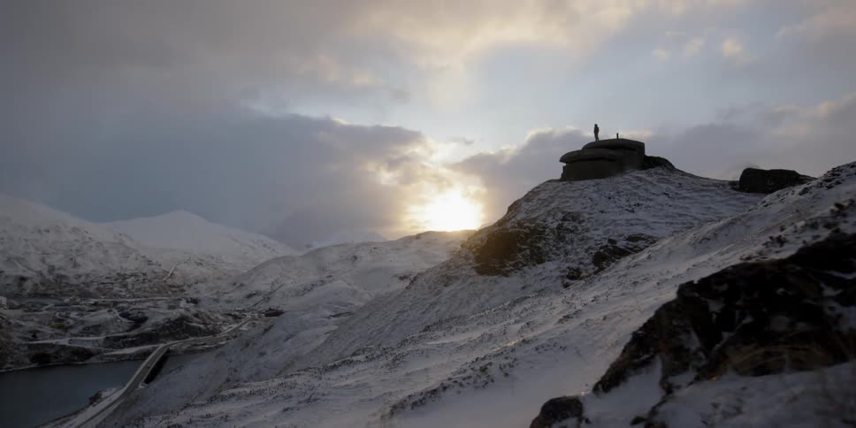 A snowy structure on a mountaintop