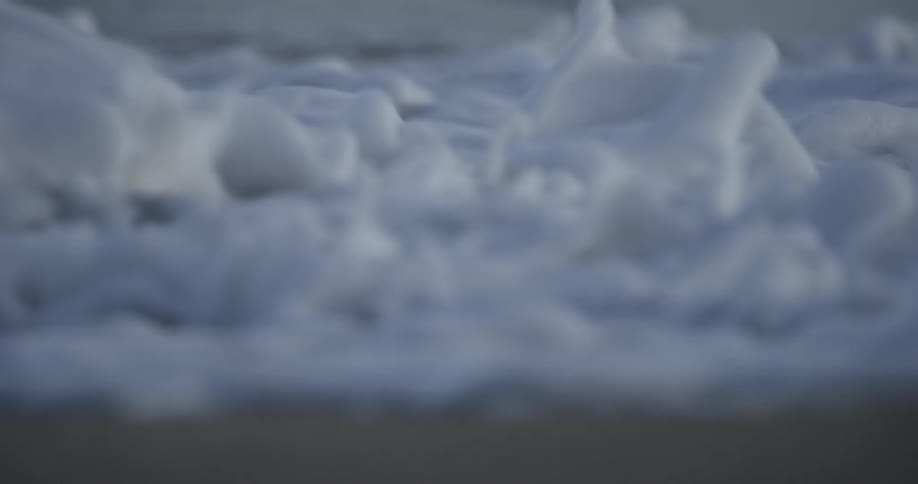 Waves are crashing onto a beach