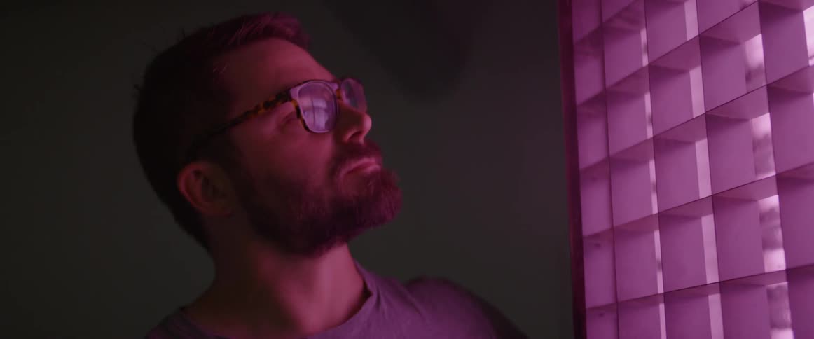 Man stands in front of a light source