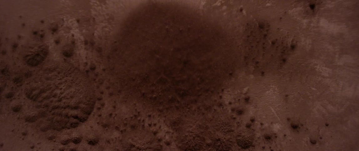Dirt vibrates and bounces into the air