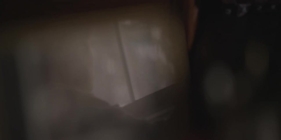 A person walking over to a window