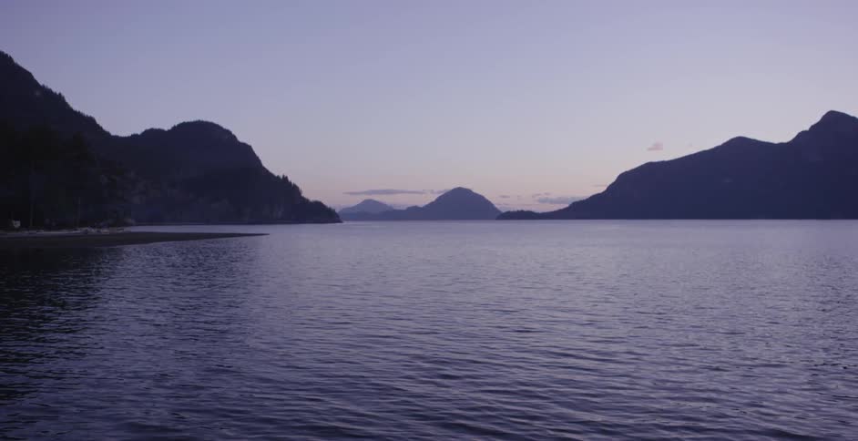 Body of water with mountains up ahead