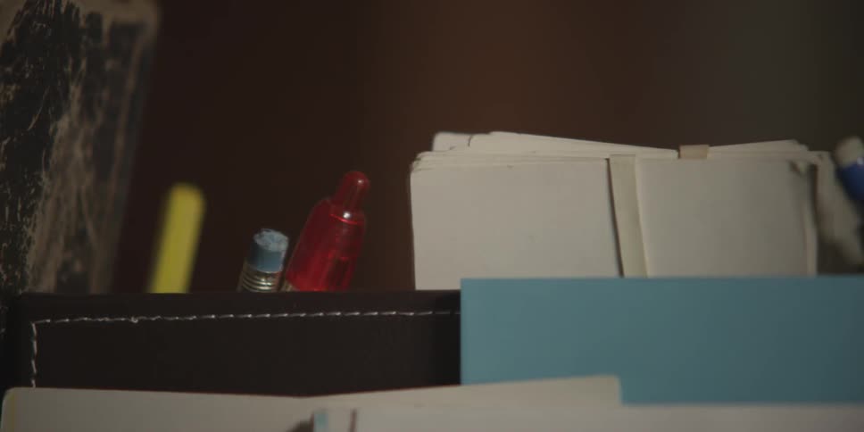 View of some pens paper and books