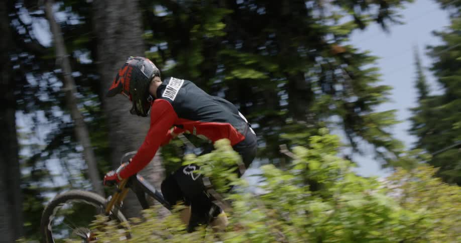 A man rides his mountain bike downhill