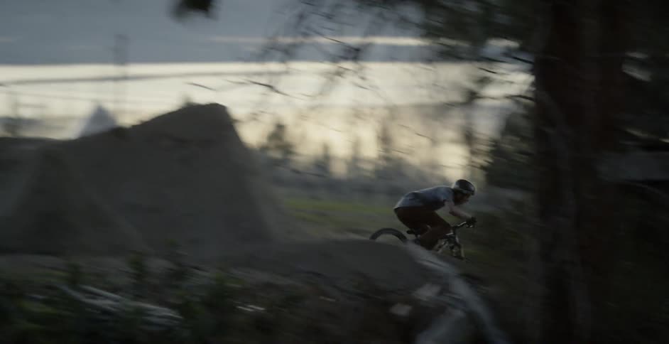 A person biking down a rocky path