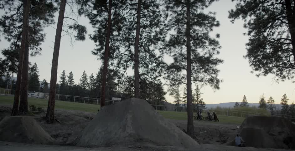A rider does tricks on his bike after jumping off a ramp