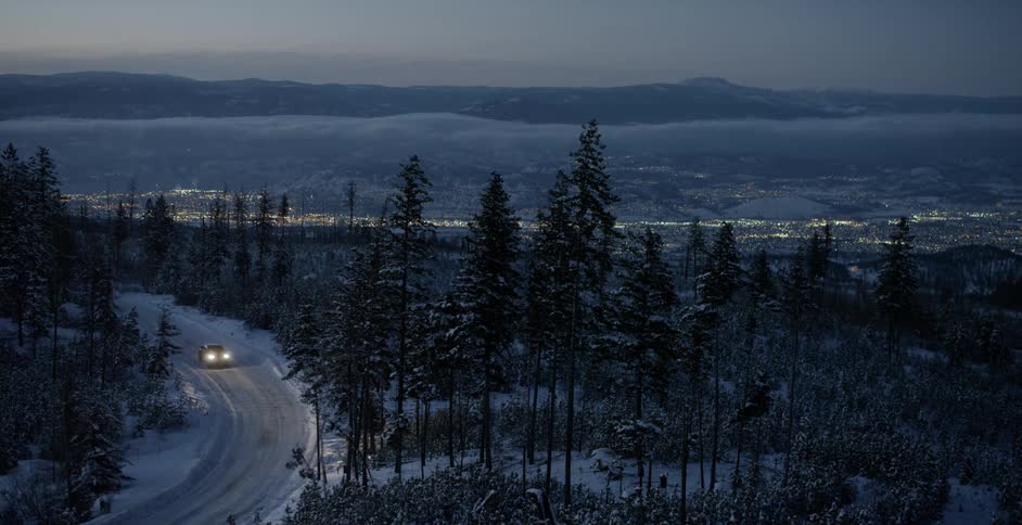 A car drives down an icy street