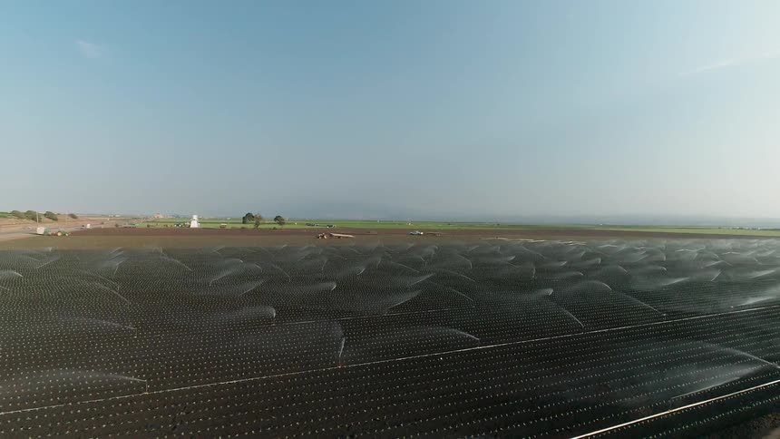 The sprinklers are watering the fields