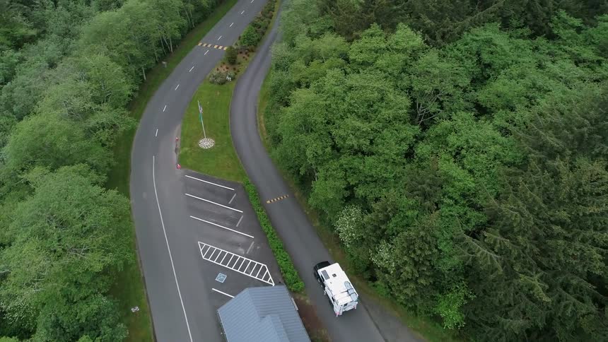 A recreational vehicle drives past a stop
