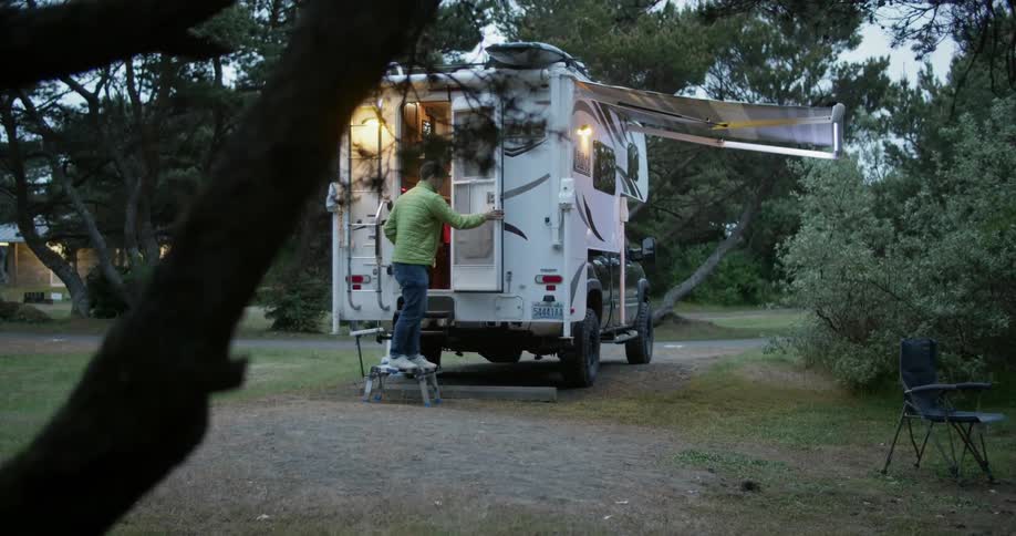 A man leaves an rv on a campground