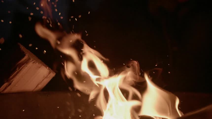 The fire sparks and moves at night