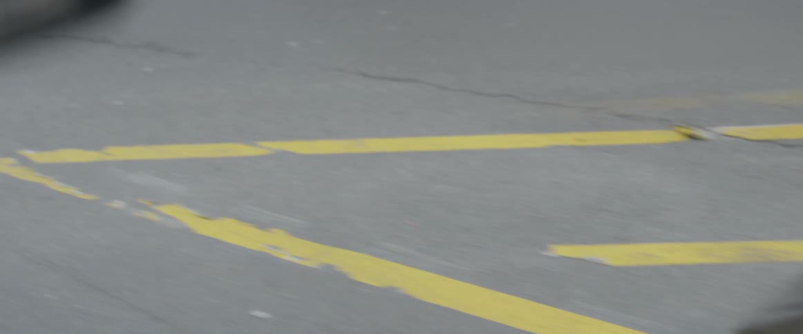 Traffic signs sit on a road
