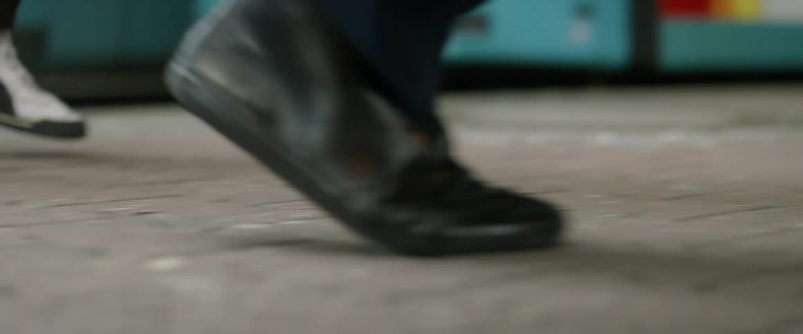 People walk on the city sidewalk