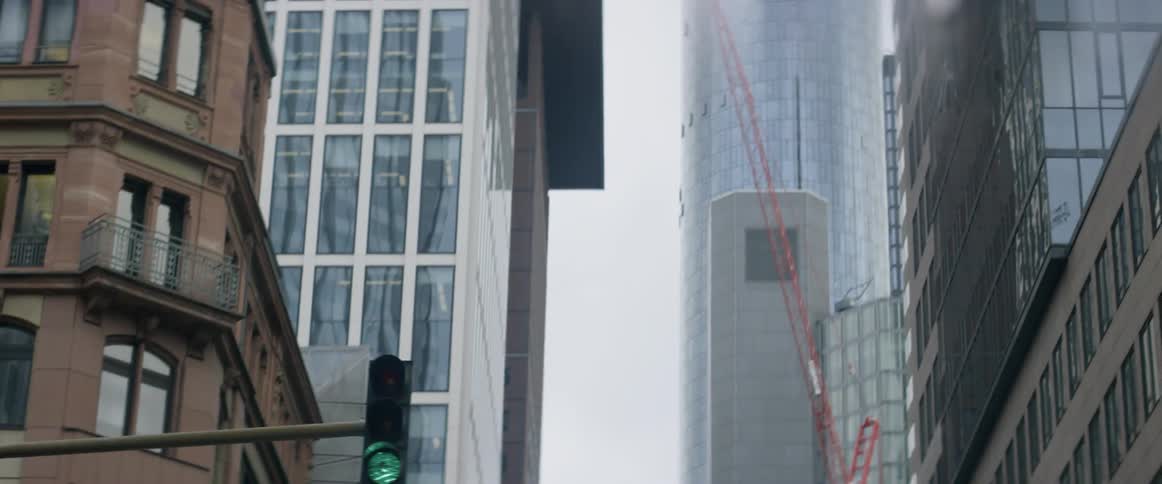 High rises line a city street on a cloudy day