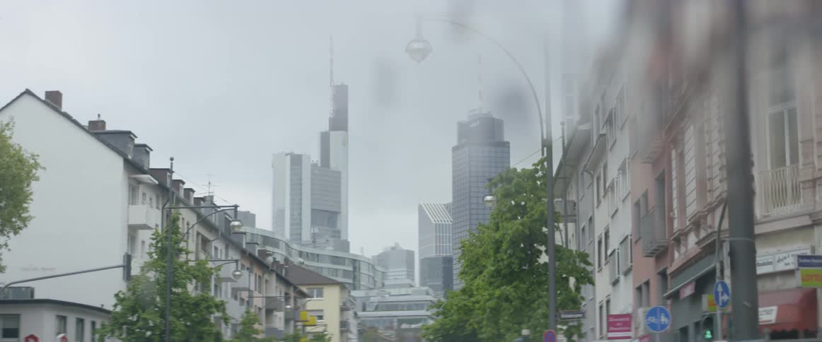 A car drives on a city street
