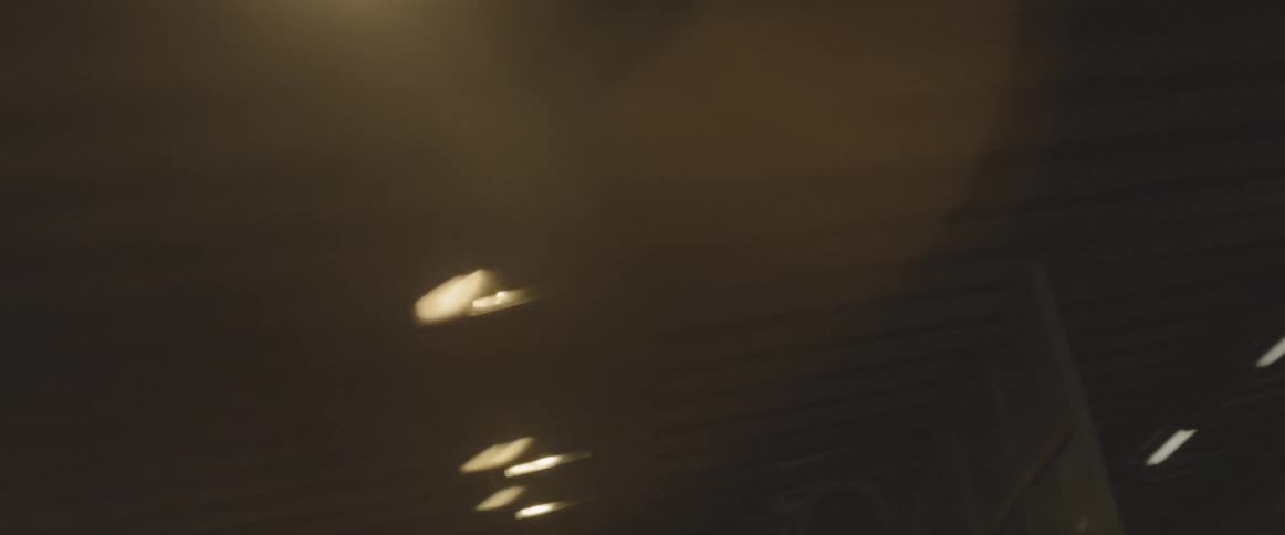 The tunnel is lined with lights on the ceiling