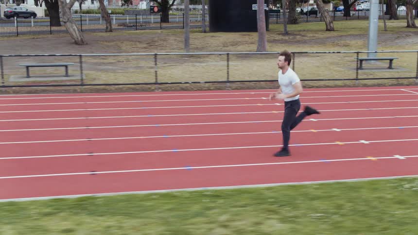 A man is running on the tracks