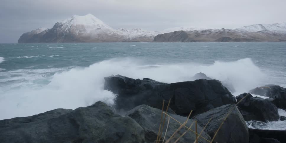 Waves crash onto the rocky shore