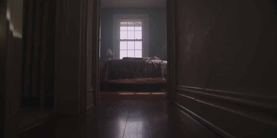 Walking down a hallway towards a bedroom