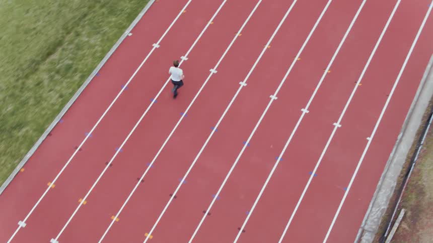 A man runs on a running track