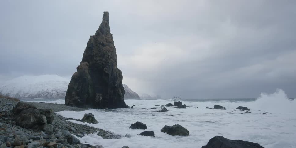 Waves crash onto the rocky shore